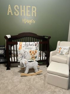 a baby's room with a rocking chair, crib and stuffed animals on the floor