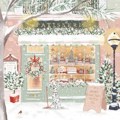 a store front with christmas decorations on it and a dog outside in the snow near a lamp post