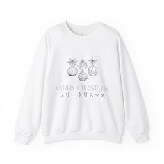 Stay cozy and festive this holiday season with this Christmas Tree Decoration Sweatshirt with Japanese characters wishing 'Merry Christmas'. Perfect for anyone looking to add some holiday spirit to their wardrobe, this unisex sweatshirt is made with a medium-heavy fabric blend of 50% cotton and 50% polyester, ensuring warmth and comfort during the colder months. The classic fit and crew neckline provide a clean-cut style, while the double-needle stitching adds durability. Say goodbye to itchines White Festive Holiday Sweater, White Holiday Festive Sweater, White Winter Tops As Gift, White Winter Tops As Gifts, White Winter Tops For Gifts, White Winter Tops As A Gift, White Winter Sweatshirt For Gift, White Winter Sweatshirt Gift, White Sweatshirt For Winter Gift