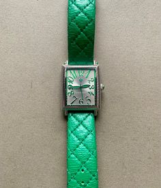 This striking women's watch features a kelly green quilted leather strap. The metal is stainless steel, and the watch is in very good condition. It was made by designer Judith Ripka. The watch battery was replaced in Aug. 2024. Watch Battery, Judith Ripka, Green Quilt, Women Wrist Watch, Women's Watch, Quilted Leather, Stainless Steel Watch, Steel Watch, Kelly Green