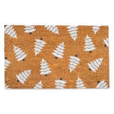 an orange door mat with white trees on it