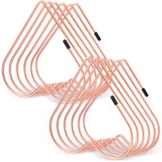 three pink metal racks with black handles on each side and one in the middle, against a white background