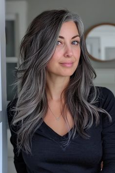 The black and grey hair color you see here is the perfect example of how beautiful grey blending can look on women of all ages! To see more salt and pepper hair ideas, click the pin to check out our blog post with over 40 gorgeous ideas. Grey Biolage Hair, Gray Hair Under 40, Salt And Pepper Balayage, Dark Hair Grey Blending, Grey Blending Dark Hair, Salt N Pepper Hair, Balayage Grey, Salt And Pepper Hair Color, Pepper Hair Color