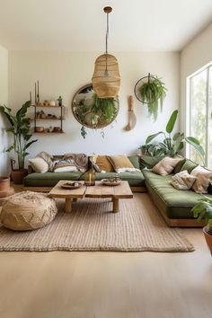 a living room filled with lots of furniture and plants