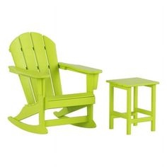 a green plastic rocking chair next to a small table with a stool on the side