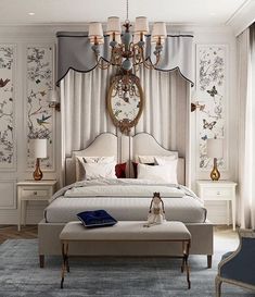 a bedroom with a large bed and chandelier hanging from it's ceiling