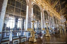 an ornate room with gold and white walls