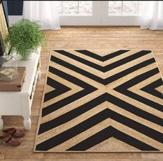 a living room area with a black and white rug