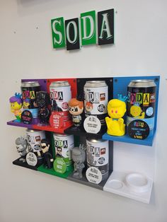 there are many soda cans on the shelf