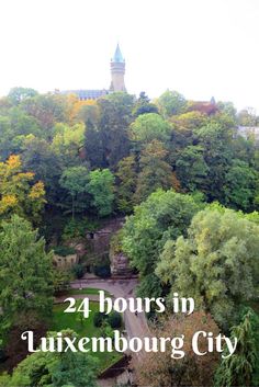 trees and buildings with the words 24 hours in luxemburg city on top