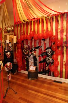 a room decorated for halloween with balloons and decorations