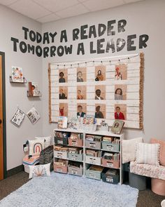 a classroom with posters on the wall and bookshelves in front of it,