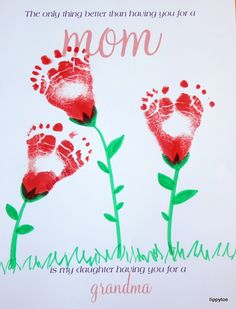 a handprinted card with two red flowers and the words, mom is my daughter facing you for a grandma