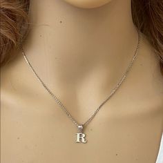 Description: 925 Sterling Silver Mini Small Initial Letter R Pendant Necklace Item No.: H89.Q Metal Type: 925 Sterling Silver (Available In 10k And 14k Gold) Metal Color: Silver Height With Bale: 15 Mm Width: 4.8 Mm Italian Rolo Chain In 16", 18", 20", Available In Another Listings In Any Letter A-Z Silver Initial Necklace In Sterling Silver, Nickel-free Silver Sterling Initial Necklace, Classic Silver Initial Pendant Necklace, Classic Silver Engraved Initial Necklace, Classic Silver Initial Necklace For Anniversary, Silver Engraved Initial Necklace For Anniversary, Silver Dainty Initial Pendant Necklace, Silver Dainty Initial Necklace With Clavicle Chain, Silver Initial Necklace For Everyday Wear