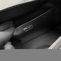 SHOP MORE LUXURY PRODUCTS HERE Description Prada Small Handbag Black For Women, Women’s Bags 10in/26cm 1BA366_2DDJ_F0002_V_OOO A study of the lines characterizes this medium handbag. It stands out for its absolutely elegant silhouette emphasized by the zipper closure with a sinuous effect. The enameled metal triangle logo decorates the accessory. Size: 25.5 x 18 x 13.5 cm /10 x 7.1 x 5.3 inches (Length x Width x Height) BlackHandlesDetachable, adjustable 105 cm shoulder strapMetal hardware High-end Black Pouch Satchel, High-end Black Pouch Bag, Luxury Pouch With Top Carry Handle, Designer Satchel With Zipper Closure, Designer Black Shoulder Bag Pouch, Designer Shopping Bags With Zipper Closure, Designer Bags With Zipper For Daily Use, Luxury Black Satchel Pouch, Designer Black Top Handle Pouch