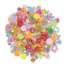 a pile of multicolored gummy bears sitting on top of a white surface