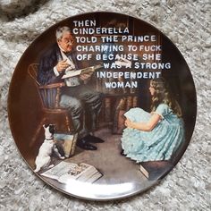 a plate with an image of a man playing the guitar and a woman sitting on a chair