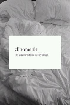 an unmade bed with the words clinoma written in black and white on it