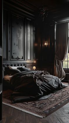 a large bed sitting on top of a wooden floor next to a window in a dark room