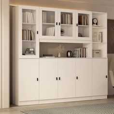 a white bookcase with many books in it