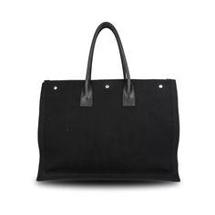 Saint Laurent 'Rive Gauche' Tote Bag in black canvas and printed logo in white. Features dual leather top handles and three push button closure. Brand = Saint Laurent Condition = 8/10, very good Dimensions = 18.75" x 14" x 7" Top Handle = 7" SKU = 22545-106 Rive Gauche, Sneaker Collection, Black Canvas, Black Tote Bag, Push Button, New Bag, Leather Top, Dress With Boots, Resort Wear