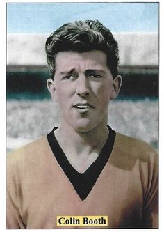 an old photo of a young man wearing a uniform and holding a soccer ball in his hand