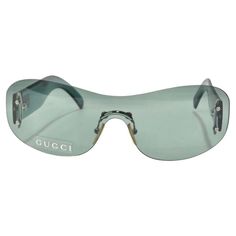 Get your hands on these incredible Gucci dead stock sunglasses circa 1990s! The perfect Y2K shield style sunglasses in this gorgeous teal/light green color. These are such a classic and fun statement pair of sunglasses! Match these to your favorite Gucci handbag and pair with some Louis Vuitton boots for a chic vintage look. Never been worn, new dead stock sunglasses in perfect condition, please see photos. Made in Italy. Vintage Luxury Silver Sunglasses, Gucci Sunglasses Star, Luxury Blue Gucci Sunglasses, Gucci Sunglasses Green, Vintage Designer Aesthetic, Botas Louis Vuitton, Statement Glasses, 2000s Sunglasses, Fire Clothes