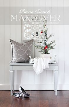 a small christmas tree sitting on top of a table next to a pair of shoes