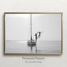 black and white photograph of two people on a sailboat in the ocean with text that reads, printtastic / nature the art of little things