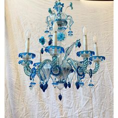 a blue chandelier hanging from the ceiling