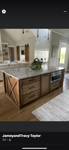 a large kitchen with an island in the middle