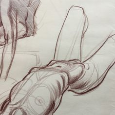 a pencil drawing of a person's arm and foot