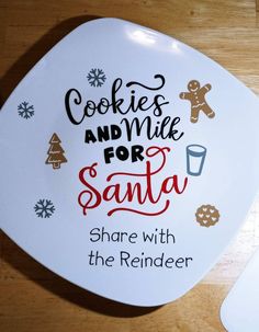 a white plate with cookies and milk for santa on it next to a computer mouse