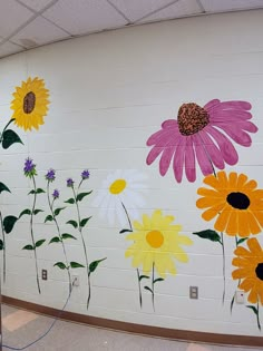 the wall is painted with flowers on it