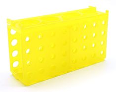 a yellow plastic container with holes on the front and sides, sitting on a white surface