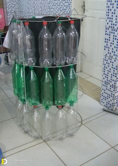 several plastic bottles stacked on top of each other in a room with tile flooring