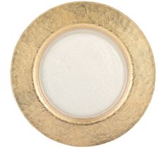 an empty gold plate with white paint on it