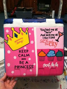 a pink and blue lunch box with princess pictures on it