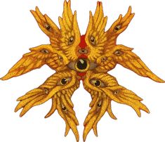 an intricately designed yellow brooch with black eyes