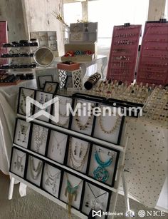 an assortment of jewelry on display in a store