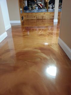 the floor is shiny and ready to be used as a room with an open bookcase