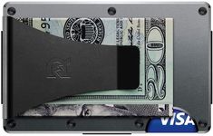 an image of a credit card holder with money in it and the word visa printed on it