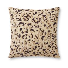 a leopard print pillow on a white background