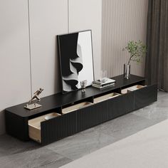 a black shelf with two drawers and a mirror