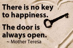 there is no key to happiness the door is always open mother teresa quote on sand