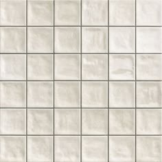 a white tile wall that is very close up