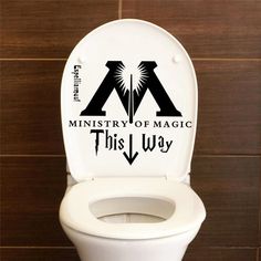 a white toilet with the words ministry of magic on it's back and side