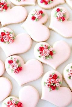 some heart shaped cookies with roses and hearts on them are being viewed on instagram