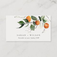 an orange tree branch with green leaves on it and the name of the wedding date