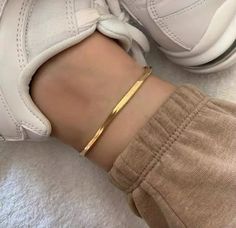 Elevate your look at the beach or pool this summer with out dainty herringbone style anklet. Perfect for stacking or wearing alone. The anklet is made of stainless steel material, so waterproof. Gold: 18k gold platingMaterial: Stainless steelLength: 22cm +6cm Waterproof jewelry Hypoallergenic Tarnish Free Glazd Pouch with every order Free US shipping Easy Exchange & Return policy PRODUCT INFOOur jewelry is made of stainless steel material. For the gold pieces, we added an 18K PVD gold plating. T Ankle Bracelets Gold, Gold Snake Chain, Foot Bracelet, Ankle Jewelry, Gold Anklet, Snake Chain Bracelets, Silver Snake Chain, Jewelry Model, Foot Jewelry